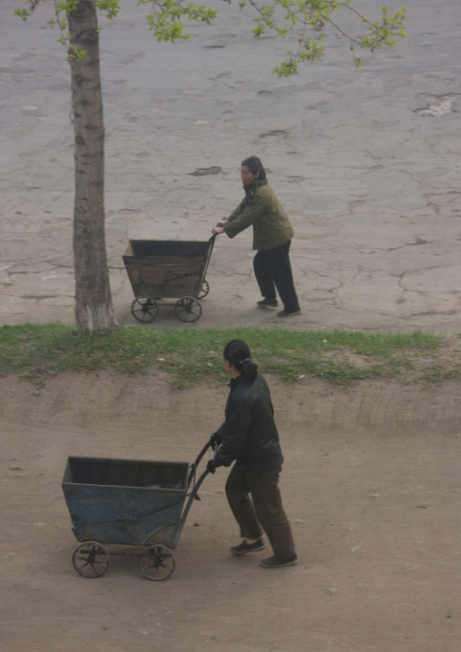 North Korean people pushing carts in the street, North Hamgyong Province, Chongjin, North Korea