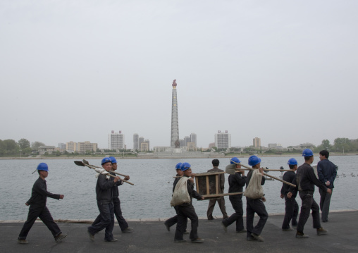 North Korean manual workers in front of Juche tower, Pyongan Province, Pyongyang, North Korea