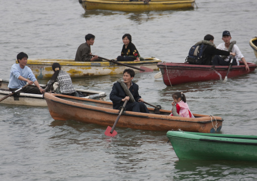 North Korean people in rowing boats on Taedong river, Pyongan Province, Pyongyang, North Korea