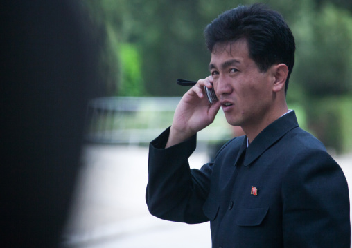 North Korean man calling with a mobile phone, Pyongan Province, Pyongyang, North Korea