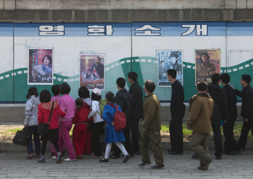 North Korean people looking at movie posters in the street, Pyongan Province, Pyongyang, North Korea
