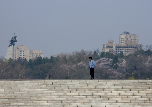 North Korean man in front of the Chollima statue, Pyongan Province, Pyongyang, North Korea