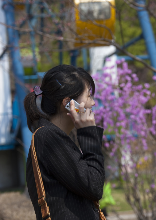 North Korean woman using a mobile phone, Pyongan Province, Pyongyang, North Korea