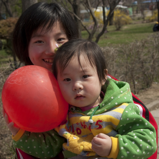 North Korean mother holding her child in her arms, Pyongan Province, Pyongyang, North Korea