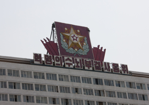 Propaganda billboard with the flag of the supreme commander of the Korean people's army at the top of a building, Pyongan Province, Pyongyang, North Korea