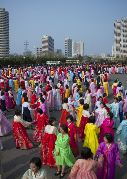 North Korean young adults during a mass dance performance in front of buildings on military foundation day, Pyongan Province, Pyongyang, North Korea
