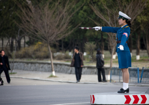 North Korean traffic security officer in blue uniform in the street, Pyongan Province, Pyongyang, North Korea