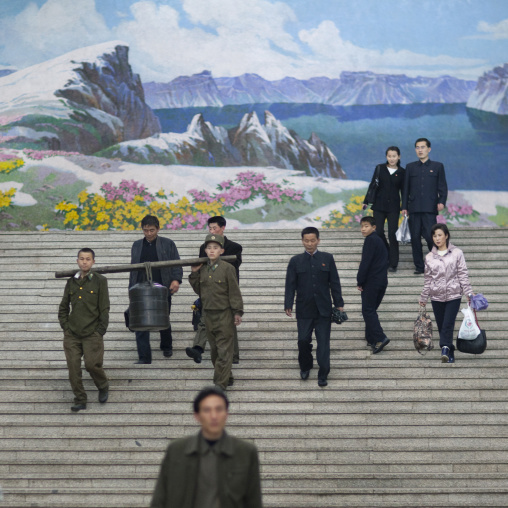 North Korean people entering Yonggwang metro station in frot of a mount Paektu fresco, Pyongan Province, Pyongyang, North Korea