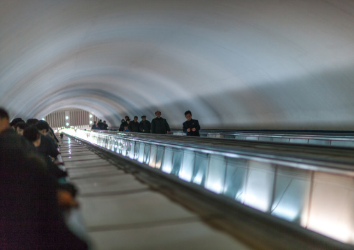 North Korean people using escalator leading to the subway station, Pyongan Province, Pyongyang, North Korea