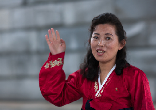Portrait of a North Korean woman with hand raised, Pyongan Province, Pyongyang, North Korea