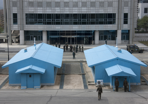 North Korean and south Korean soldiers standing in front of the United Nations conference rooms on the demarcation line in the Demilitarized Zone, North Hwanghae Province, Panmunjom, North Ko