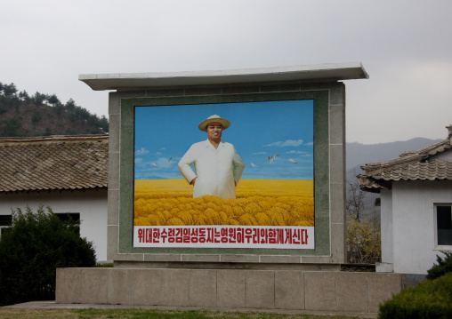 North Korean propaganda billboard depicting Kim il Sung in a field, North Hwanghae Province, Kaesong, North Korea