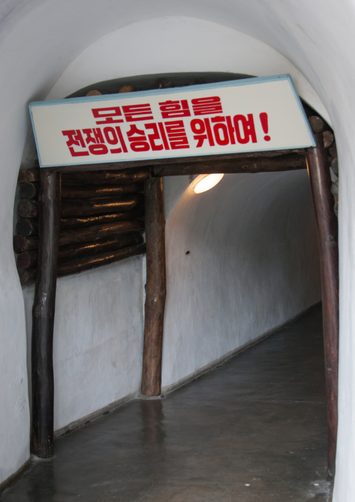 Tunnel in Jonsung revolutionary museum with the slogan all the powers for the war victory!, Pyongan Province, Pyongyang, North Korea