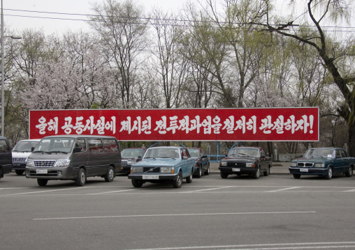 North Korean propaganda billboard on a parking, Pyongan Province, Pyongyang, North Korea