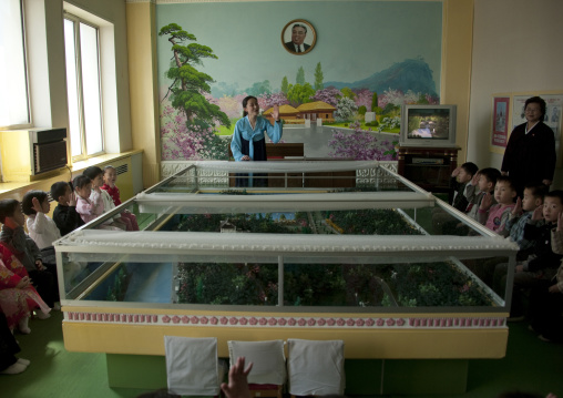 North Korean teacher during a lesson about Kim il sung's life in Kwangbok primary school, Pyongan Province, Pyongyang, North Korea