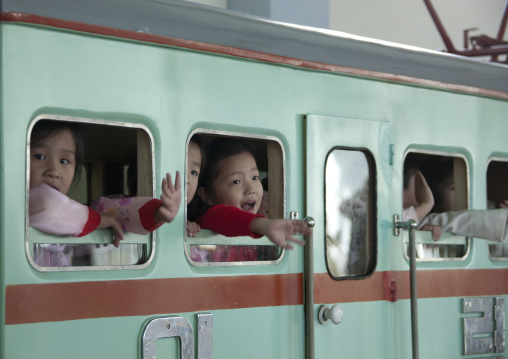 Children having fun in a fake locomotive at Kwangbok primary school, Pyongan Province, Pyongyang, North Korea