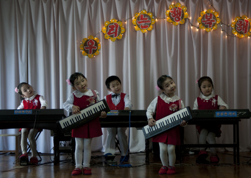 North Korean children playing music in Kwangbok school, Pyongan Province, Pyongyang, North Korea