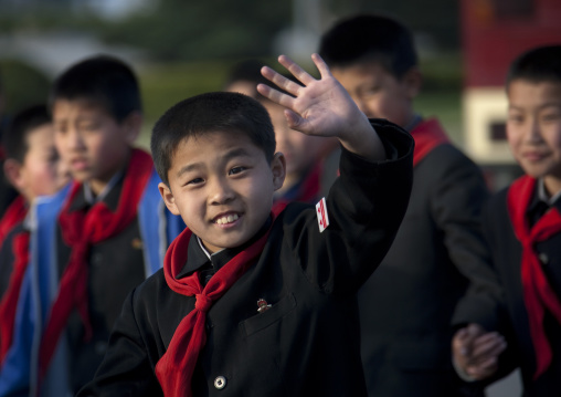 North Korean pioneer boy waving hand, Pyongan Province, Pyongyang, North Korea