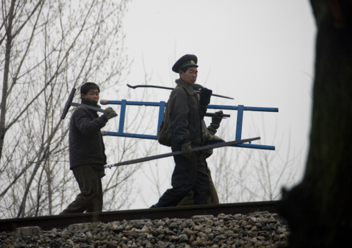 North horean men repairing the railway, Pyongan Province, Pyongyang, North Korea