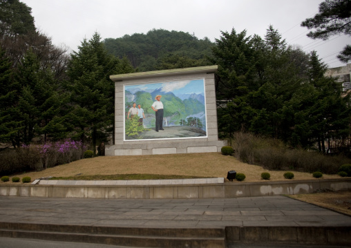 Propaganda fresco depicting Kim Il-sung in a relaxed atitude with a hat, Hyangsan county, Mount Myohyang, North Korea