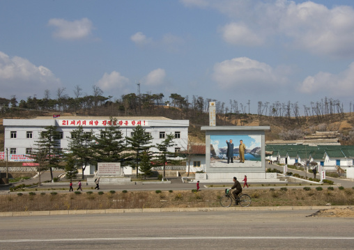 The Dear Leaders fresco at the entrance of a village, Pyongan Province, Pyongyang, North Korea