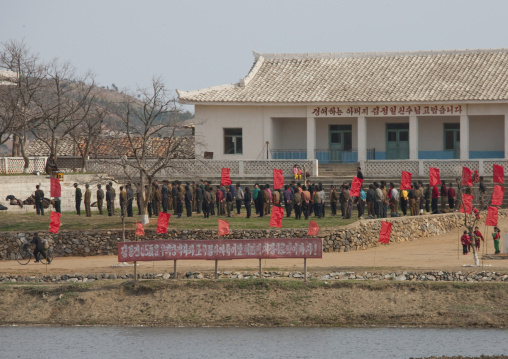 North Korean men training on the banks of a river, Kangwon Province, Wonsan, North Korea