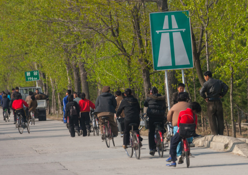 North Korean people using the highway with bicycles to go to collective works, Pyongan Province, Pyongyang, North Korea
