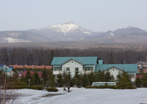 New apartment houses in the snow with a view on mount Paektu, Ryanggang Province, Samjiyon, North Korea