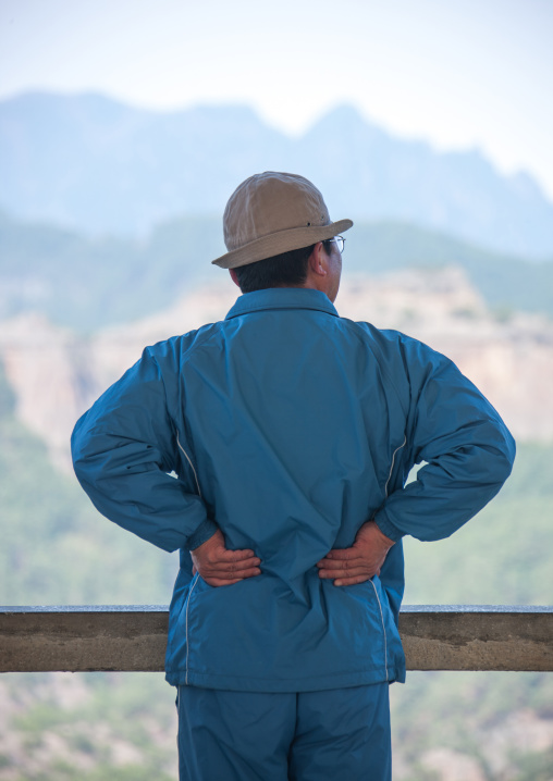 Portrait of a North Korean man in blue sweatsuit, North Hamgyong province, Chilbosan, North Korea