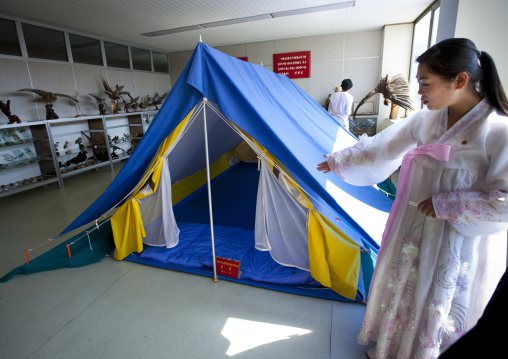 North Korean woman showing a tent visited by Kim Jong il in Songdowon international children's camp, Kangwon Province, Wonsan, North Korea