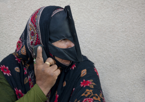 Bedouin Masked Woman Talking In Mobile Phone, Sinaw, Oman