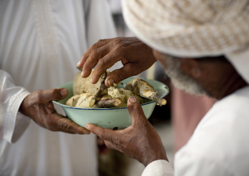 Men Sharing Honey In Sinaw Market, Oman
