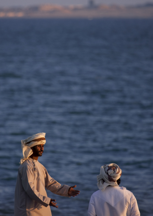 Two Men Chatting With The Background Of The Sea, Masirah Island, Oman