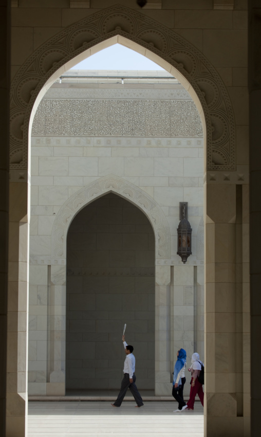 Man Passing By Sultan Qaboos Grand Mosque In Muscat, Oman