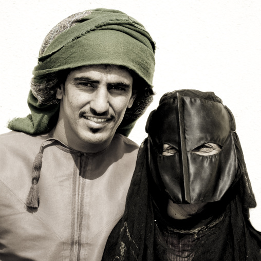 Bedouin Man In Green Turban And Masked Woman In Black, Sinaw, Oman