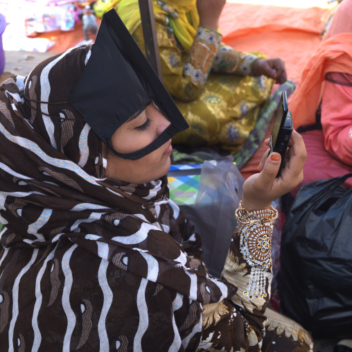 Bedouin Woman Looking At Her Mobile Phone, Ibra, Oman
