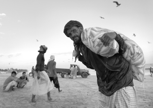 Old Man Taking A Bag Of Sardine, Salalah, Oman