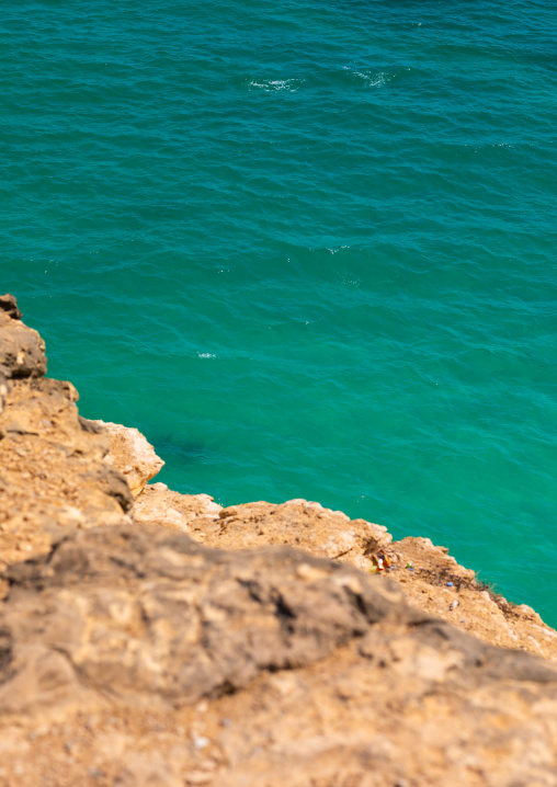 Cliff over the green water, Dhofar Governorate, Taqah, Oman