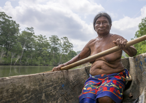 Panama, Darien Province, Puerta Lara, Old Wounaan Tribe Woman Rowing In A Canoe