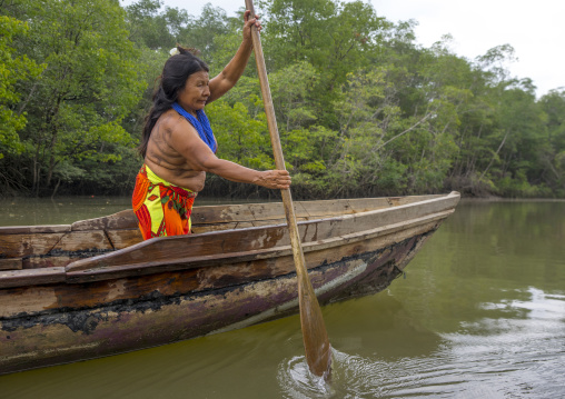 Panama, Darien Province, Puerta Lara, Wounaan Tribe Woman Rowing In A Canoe
