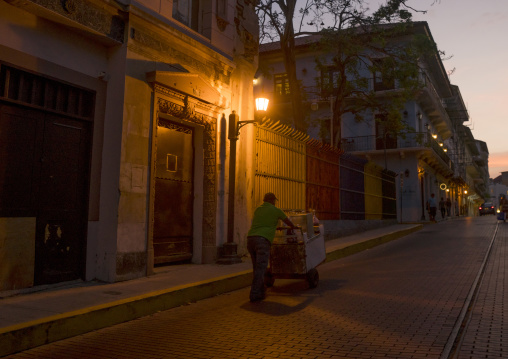 Panama, Province Of Panama, Panama City, Man Passing In The Streets Of Casco Viejo At Sunset