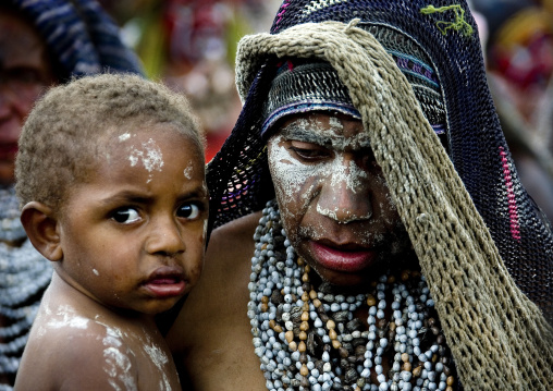 Mourning mother with her boy, Western Highlands Province, Mount Hagen, Papua New Guinea