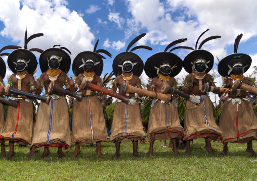 Enga kompian suli muli wigmen dancing in line during a Sing-sing, Western Highlands Province, Mount Hagen, Papua New Guinea