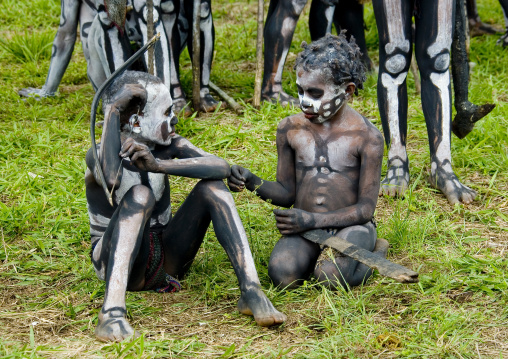 Skeleton tribe boys during a sing-sing ceremony, Western Highlands Province, Mount Hagen, Papua New Guinea