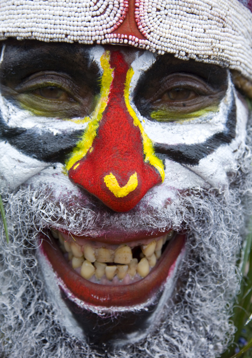 Portrait of a smiling highlander warrior with traditional makeup, Western Highlands Province, Mount Hagen, Papua New Guinea