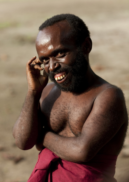 Portrait of a dwarf man smiling, New Ireland Province, Langania, Papua New Guinea