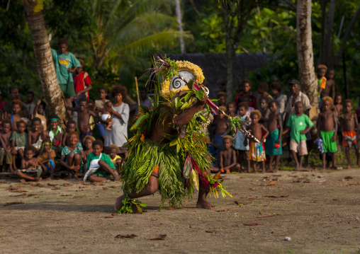 Malagan tatuana masks dance during a funeral ceremony, New Ireland Province, Langania, Papua New Guinea