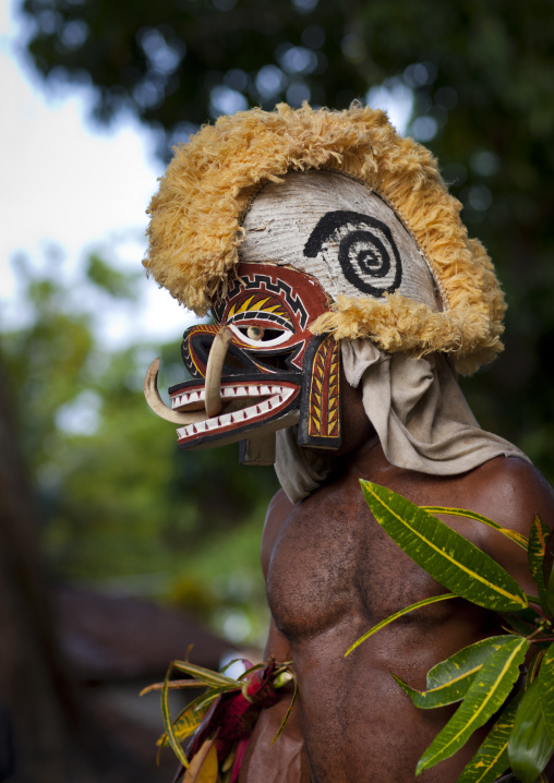 Malagan tatuana masks dance during a funeral ceremony, New Ireland Province, Langania, Papua New Guinea