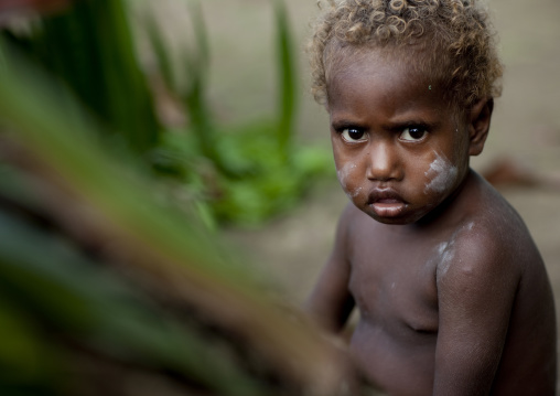 Boy with blonde hair, New Ireland Province, Langania, Papua New Guinea