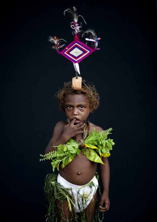 Portrait of a girl during Malagan tatuana masks dance, New Ireland Province, Langania, Papua New Guinea